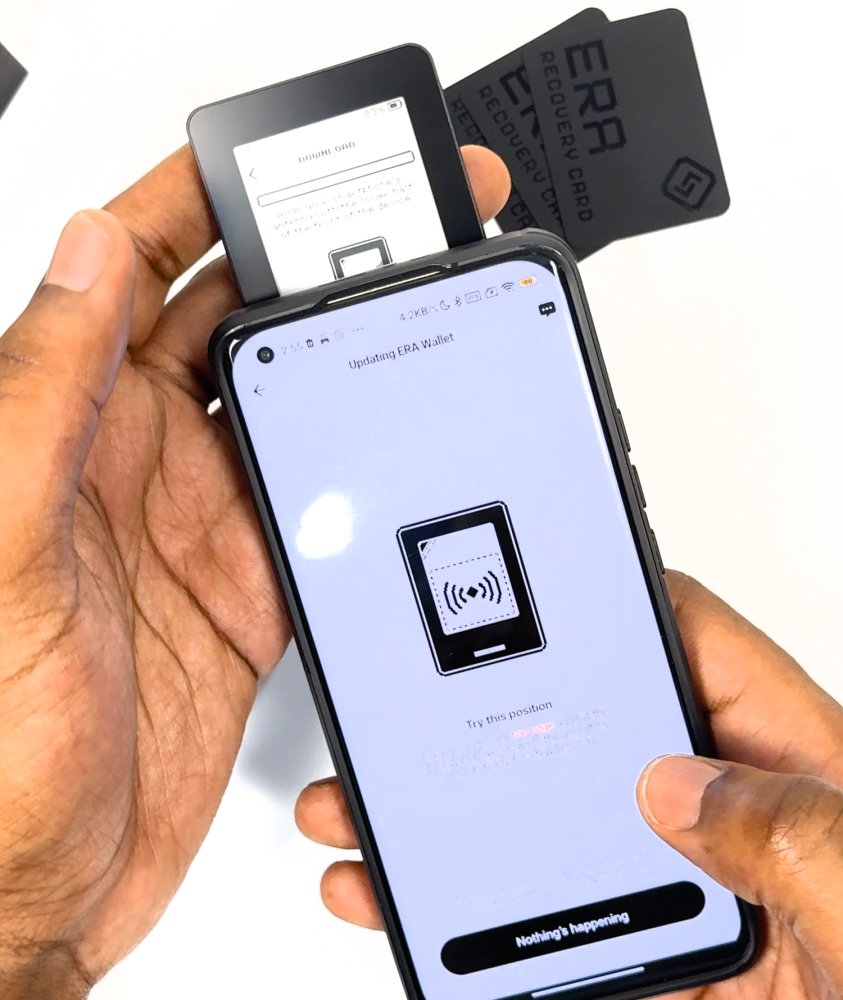 ERA lying on the upper part of the phone screen while the app shows its NFC page.