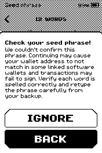 Check your seed phrase warning with IGNORE and BACK buttons.